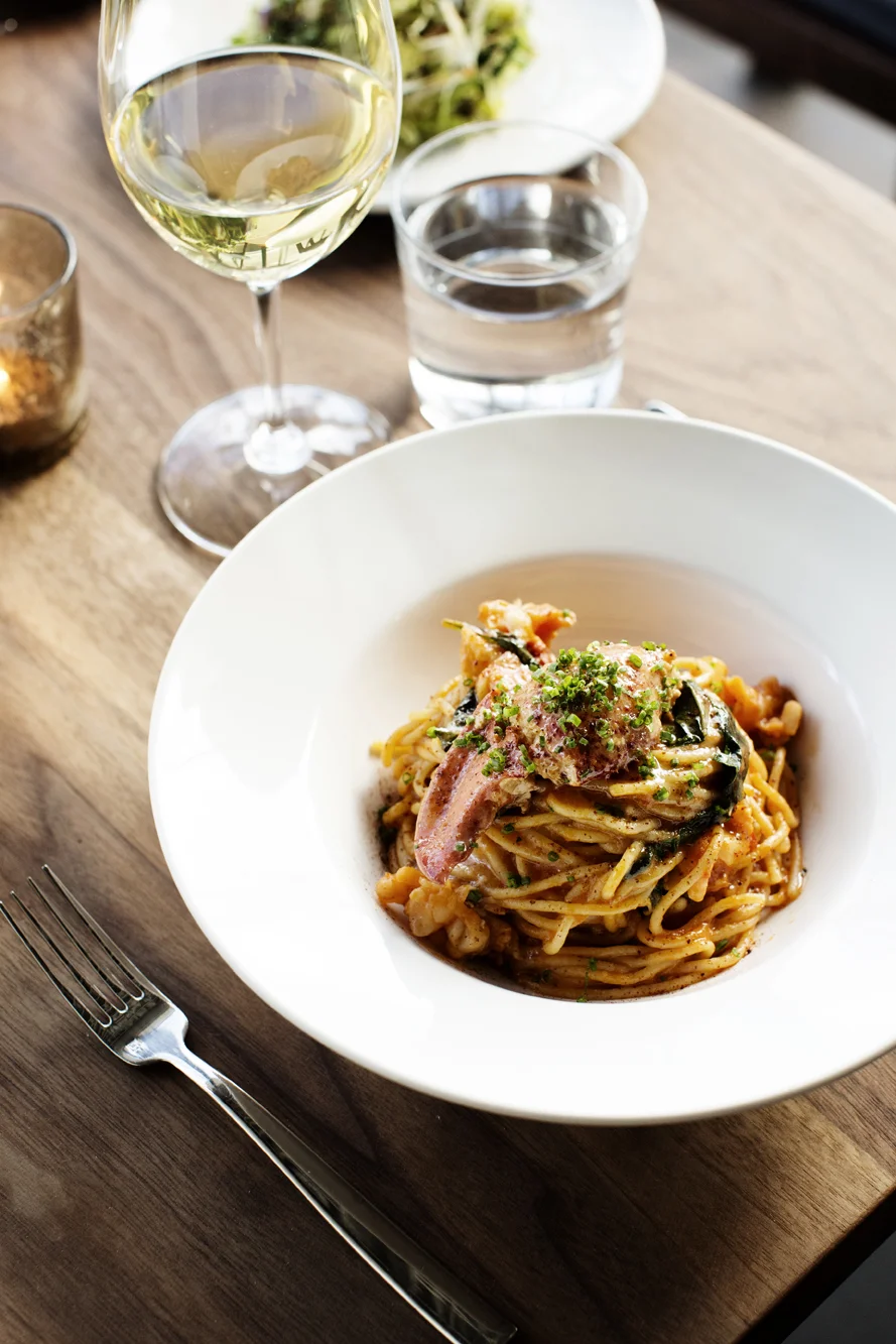 Martina signature dishes Sweet Potato Churros, Crab Benedict, Spaghetti Fra Diavolo.